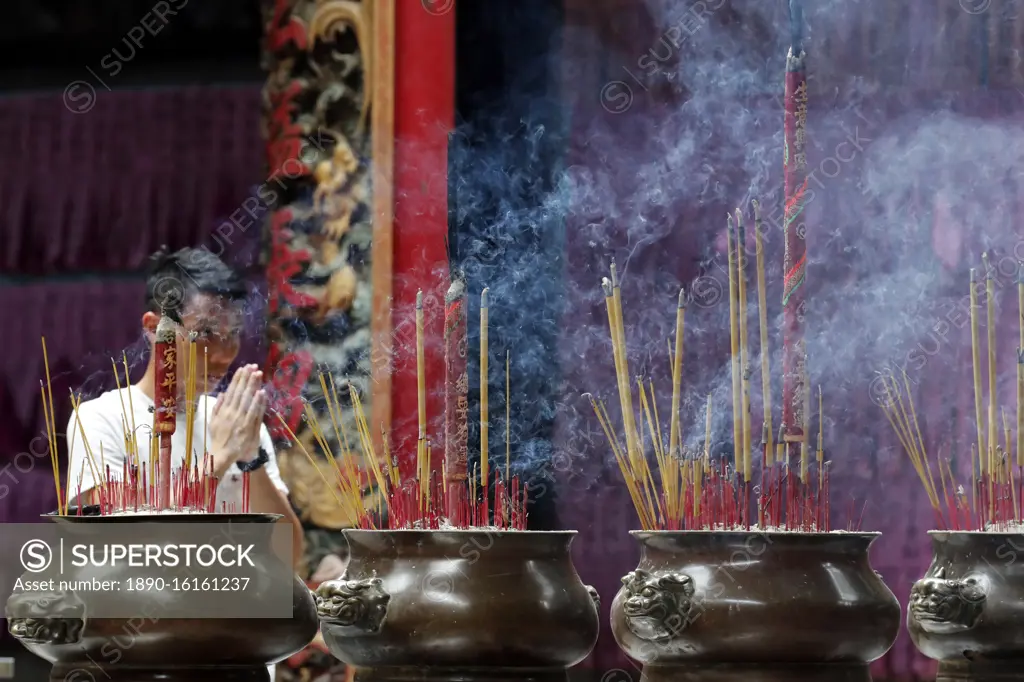 Incense sticks burning and smoking in joss stick pot in Taoist temple, Phuoc An Hoi Quan Pagoda, Ho Chi Minh City, Vietnam, Indochina, Southeast Asia, Asia