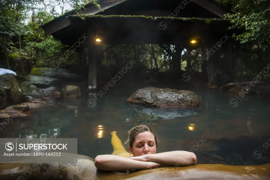 Woman enjoying the hot waters of the Kurokawa onsen, public spa, Kyushu, Japan, Asia