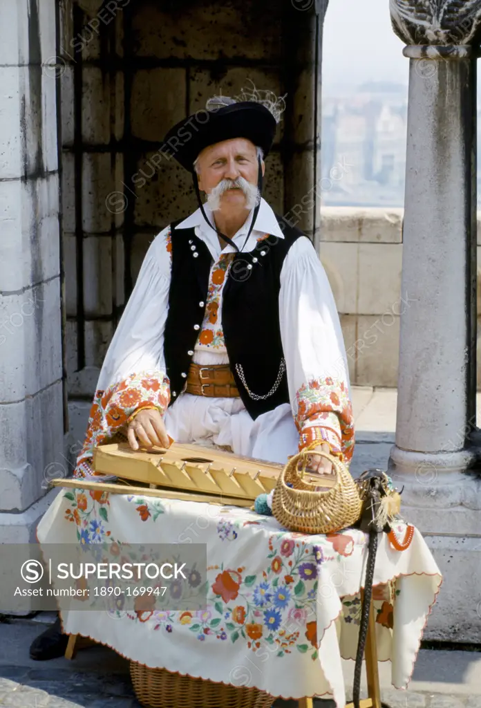 Hungarian man in traditional clothing with Hungarian musical instrument in Budapest, Hungary