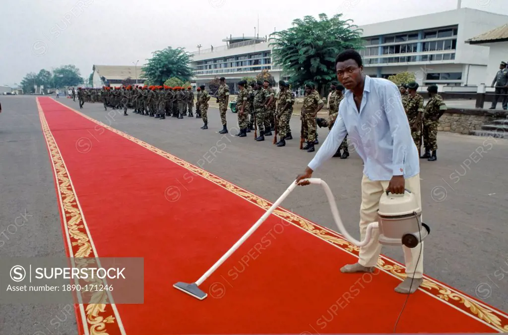 Red carpet being cleaned ready for VIP arrival in Cameroon, West Africa