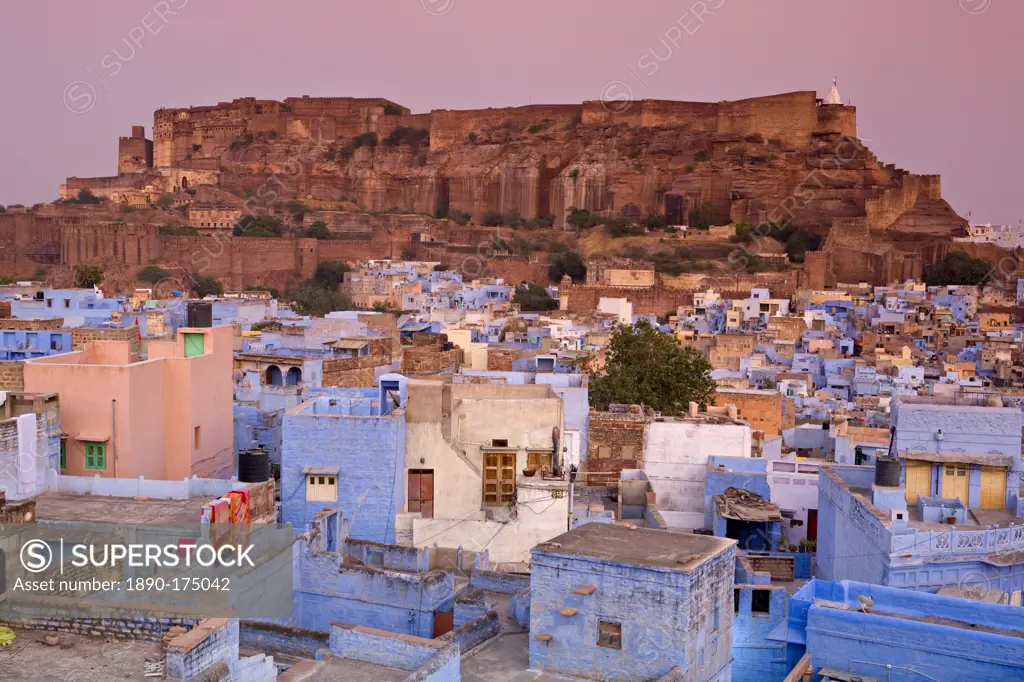 Elevated view over colorful houses of the Blue City towards Meherangarh Fort, Jodhpur, Western Rajasthan, India, Asia