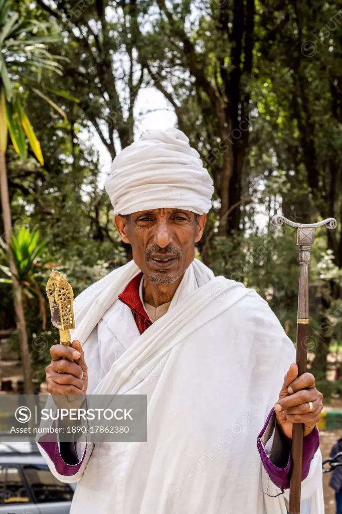 Portrait of Ethiopian Orthodox priest holding the praying stick, Addis Ababa, Ethiopia, Africa