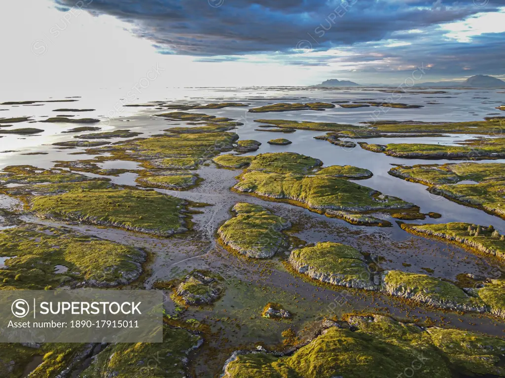 Aerial of the rugged coastline of the UNESCO World Heritage Site at sunset, the Vega Archipelago, Norway, Scandinavia, Europe