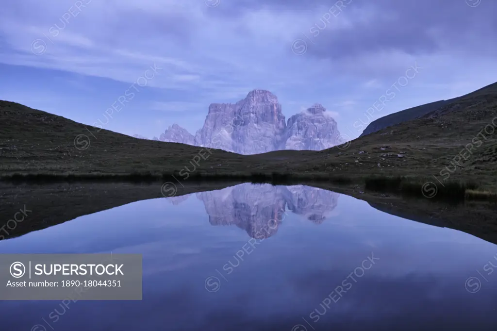 Reflection of Pelmo mountain in the Baste lake during blue hour, Dolomites, Trentino-Alto Adige, Italy, Europe