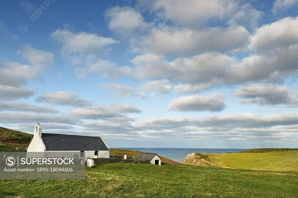 The 13th century Church of the Holy Cross, a Grade 1 listed parish church near popular Mwnt beach, Mwnt, Ceredigion, Wales, United Kingdom, Europe