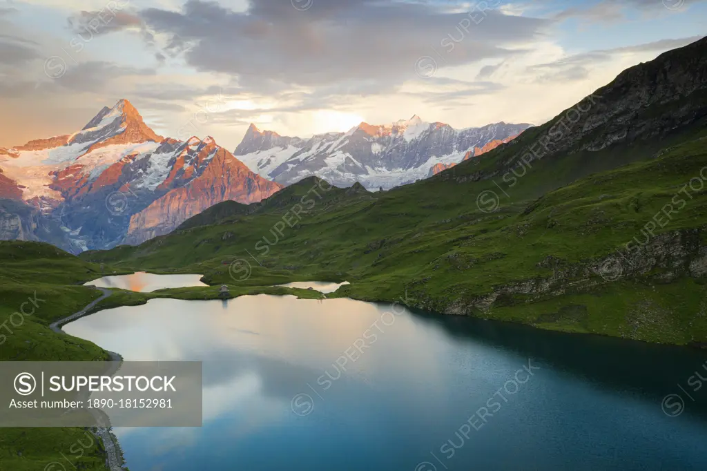 Schreckhorn and Finsteraarhorn peaks reflected in Bachalpsee lake at sunset, Grindelwald, Bernese Oberland, Switzerland, Europe