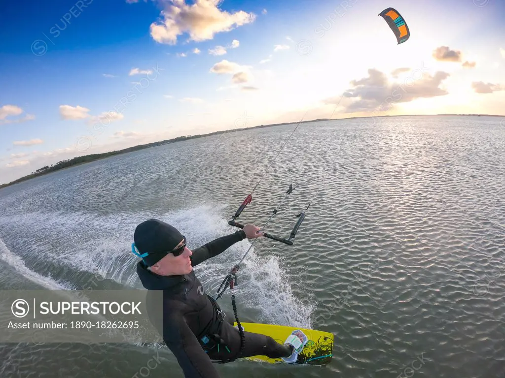 Photographer Skip Brown kiteboards on flat water on Chesapeake Bay at Hampton, Virginia, United States of America, North America