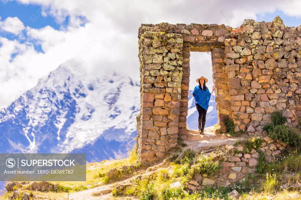 Woman exploring Inti Punku (Sun Gate), Cusco, Peru, South America