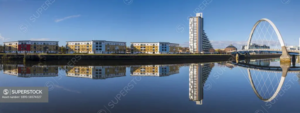 Panoramic reflection of Clyde Arc (Squinty Bridge) and flats, River Clyde, Glasgow, Scotland, United Kingdom, Europe