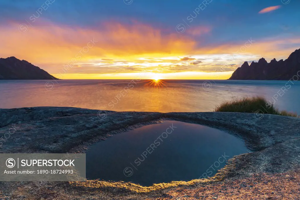 Ersfjord and Steinfjord fjords lit by midnight sun from rock formation at Tungeneset viewpoint, Senja, Troms county, Norway, Scandinavia, Europe