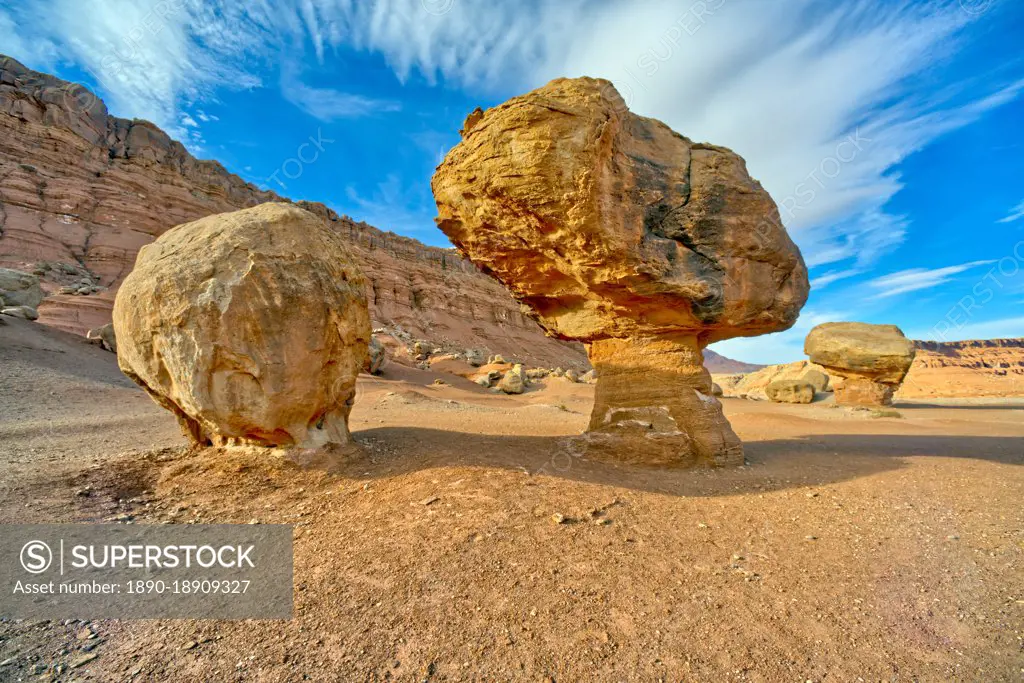 Balanced boulders at the base of Vermilion Cliffs in Glen Canyon Recreation Area, Arizona, United States of America, North America