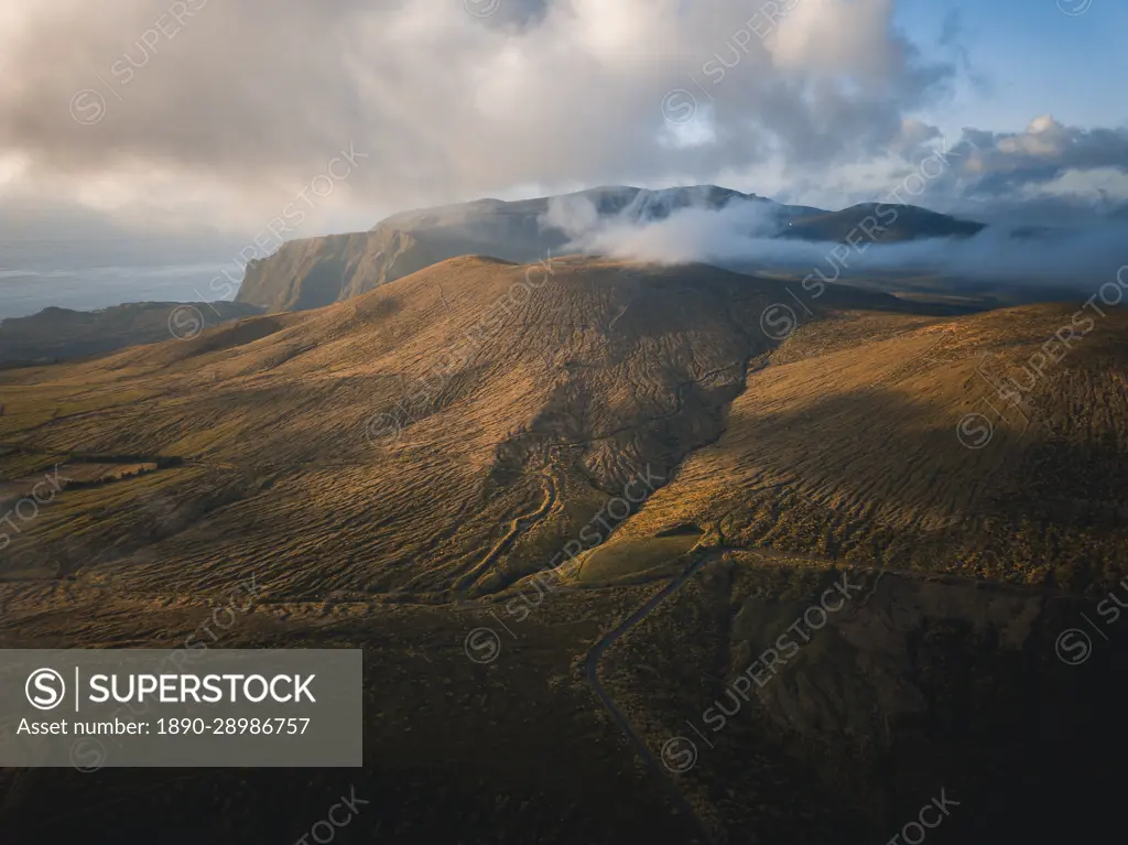 Aerial view at sunset of clouds over Flores island's mountains, Azores islands, Portugal, Atlantic, Europe