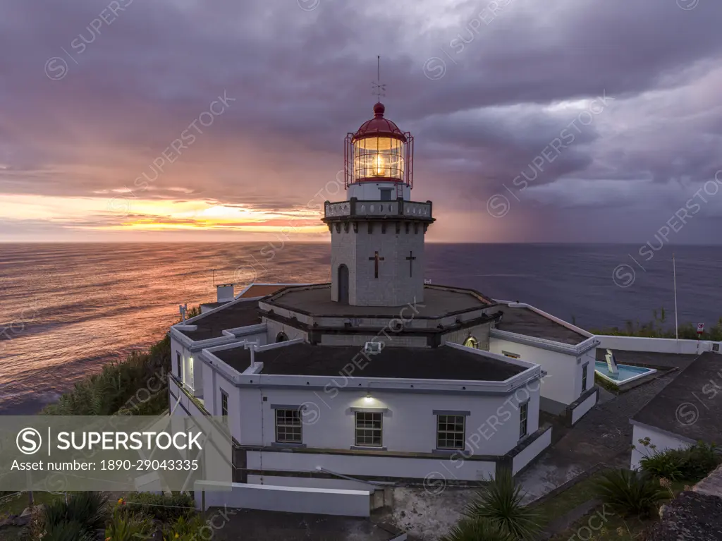 Farol do Arnel lighthouse at sunrise in a cloudy morning, Sao Miguel island, Azores, Portugal, Atlantic, Europe