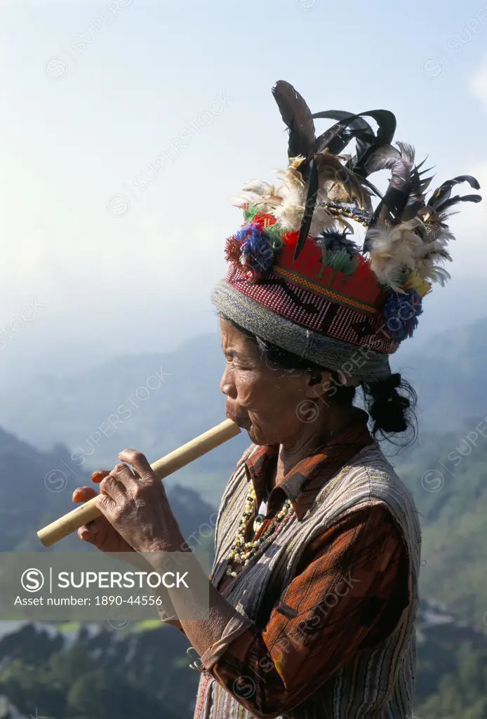 Ifugao person playing a pipe, northern area, island of Luzon, Philippines, Southeast Asia, Asia