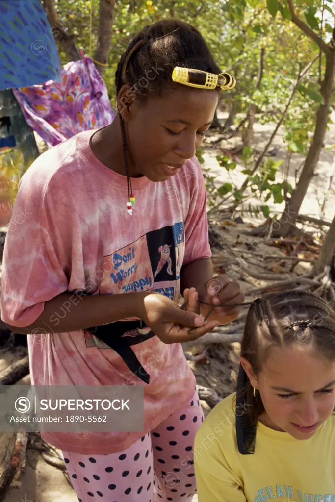 Women braiding young girl´s hair, Mayreau Island, the Grenadines, Windward Islands, West Indies, Caribbean, Central America