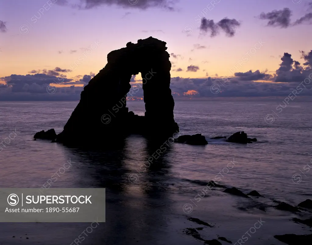 Gaada Stack natural arch, 45 m high, at sunset, Foula, Shetland Islands, Scotland, United Kingdom, Europe