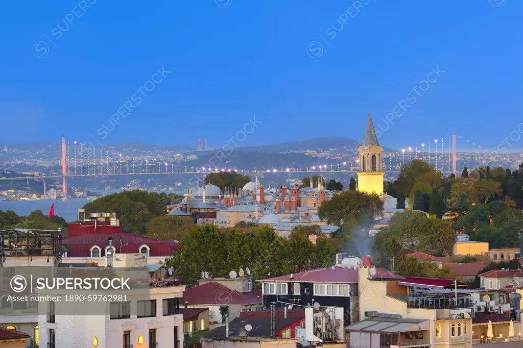 View of rooftops and Bosphorus Bridge at sunset, Istanbul, Turkey, Europe