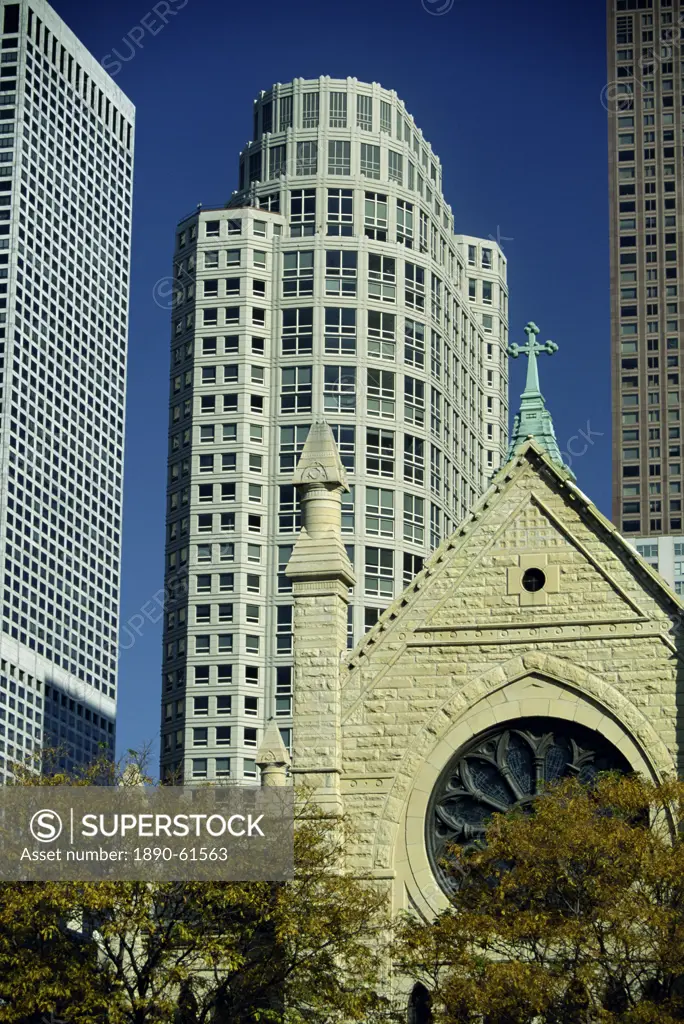 Holy Name Cathedral with tower blocks of the Near North of downtown Chicago in the background, Chicago, Illinois, United States of America, North Amer...