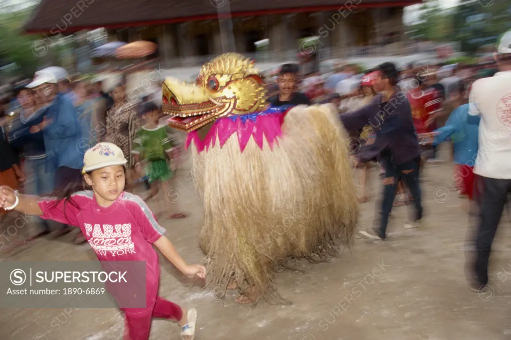 New Year Pimai ritual with Pou Nyeu and Nya Nyeu, Lao peoples ancestors, with lion cub Singkeo in the parade, in Luang Prabang, Laos, Indochina, South...