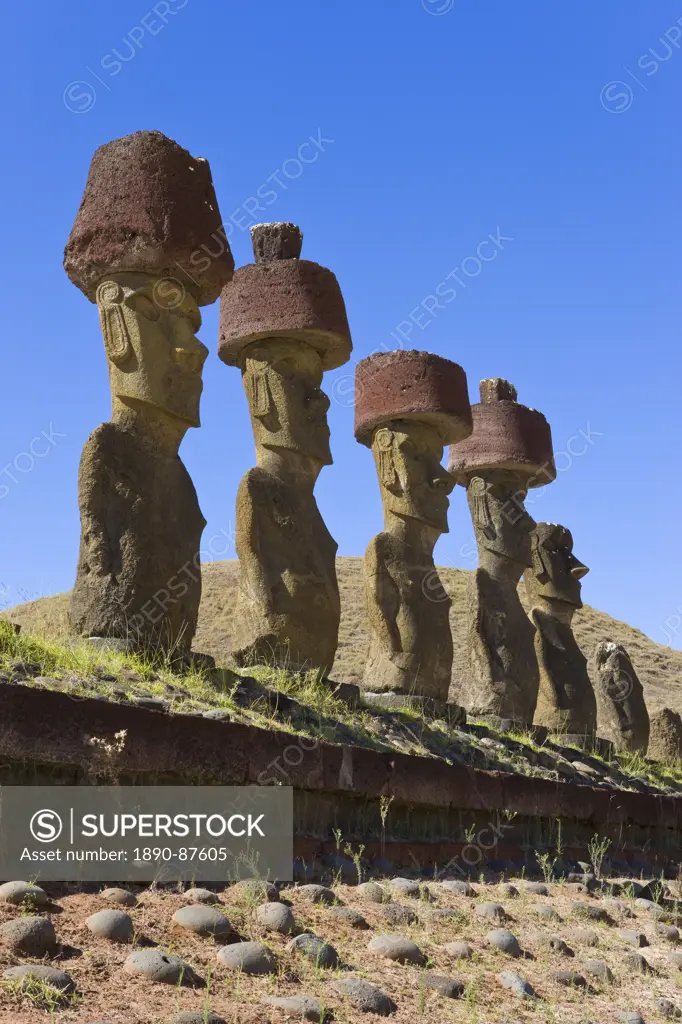 Anakena beach, monolithic giant stone Moai statues of Ahu Nau Nau, four of which have topknots, Rapa Nui Easter Island, UNESCO World Heritage Site, Ch...