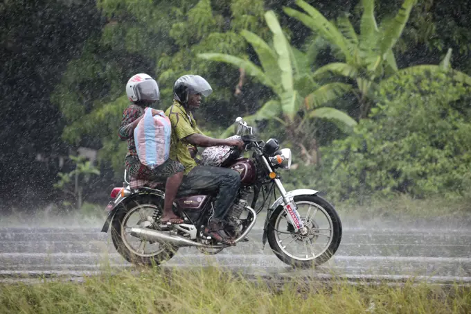 African road in the rain, Ouidah, Benin, West Africa, Africa