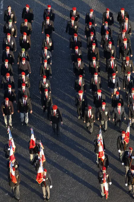 War veterans marching to the Arc de Triomphe, Paris, France, Europe