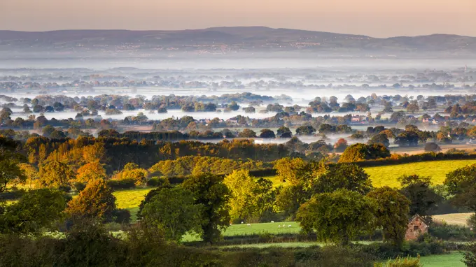 Autumn mists on the Cheshire plain extending across the landscape to the Welsh hills, Cheshire, England, United Kingdom, Europe