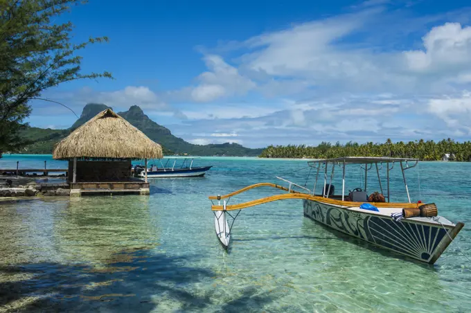 Little boat anchoring on a small Motu, Bora Bora, Society Islands, French Polynesia, Pacific