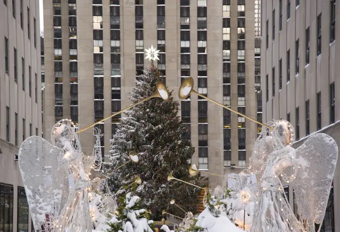 The Christmas tree and decorations under fresh snow in Rockefeller Center, New York City, New York State, United States of America, North America