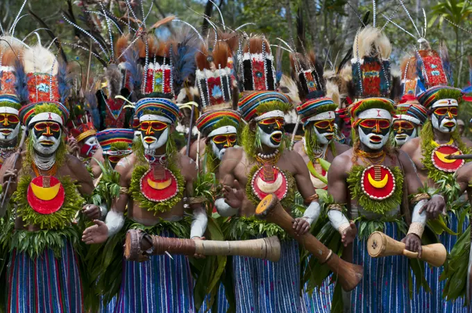 Colourful dressed and face painted local tribes celebrating the traditional Sing Sing in Paya, Papua New Guinea, Melanesia, Pacific