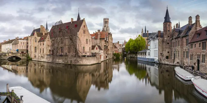 House reflections and boats on Dijver canal, Bruges, West Flanders province, Flemish region, Belgium, Europe