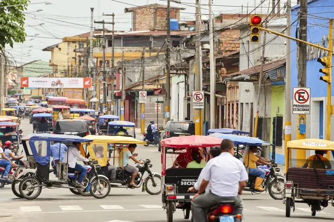 Mototaxis in a busy street in Iquitos, Peru, South America