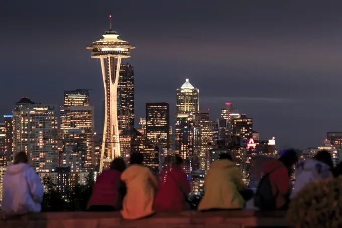 Seattle city skyline at night with illuminated office buildings and Space Needle viewed from public garden near Kerry Park, Seattle, Washington State,...