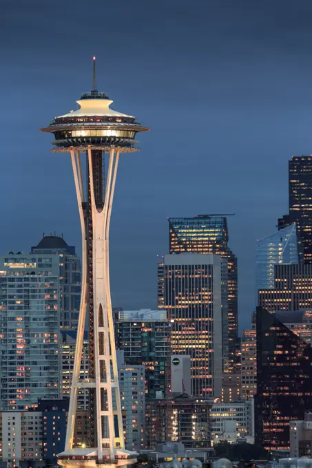 Seattle city skyline at night with illuminated office buildings and Space Needle viewed from public garden near Kerry Park, Seattle, Washington State,...