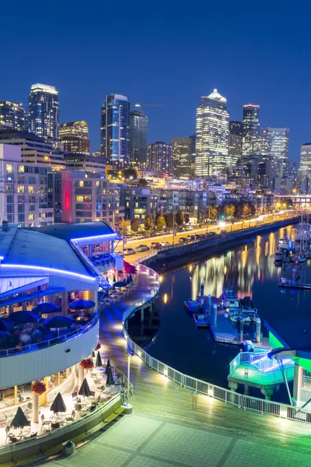 Elevated view of Seattle skyline and restaurants in Bell Harbour Marina at dusk, Belltown District, Seattle, Washington State, United States of Americ...