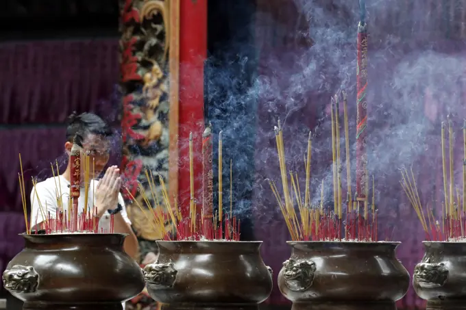 Incense sticks burning and smoking in joss stick pot in Taoist temple, Phuoc An Hoi Quan Pagoda, Ho Chi Minh City, Vietnam, Indochina, Southeast Asia, Asia