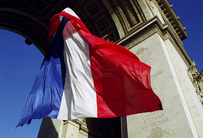 French Tricolore flag at the Arc de Triomphe for Remembrance Day in Paris, France