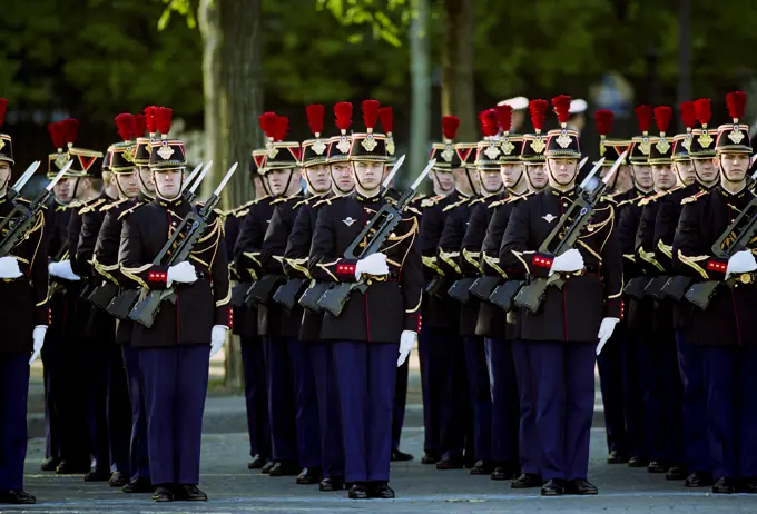 French soldiers with fixed bayonets in parade for Remembrance Day at the Arc de Triomphe in Paris, France