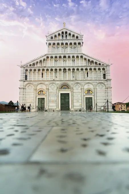 Romanesque facade of Pisa Cathedral (Duomo) under romantic sky at sunrise, Piazza dei Miracoli, UNESCO World Heritage Site, Pisa, Tuscany, Italy, Europe