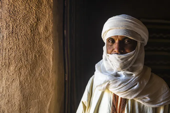 Guardian standing in the Interior of the French Fort in the Oasis of Timia, Air Mountains, Niger, Africa