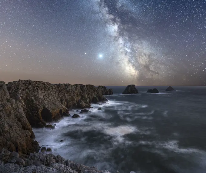 Long exposure of the Milky Way above the cape of Pen Hir, Brittany, France, Europe