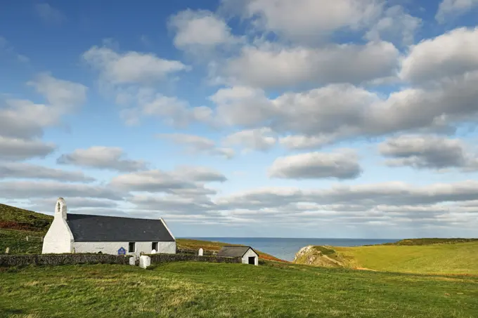 The 13th century Church of the Holy Cross, a Grade 1 listed parish church near popular Mwnt beach, Mwnt, Ceredigion, Wales, United Kingdom, Europe