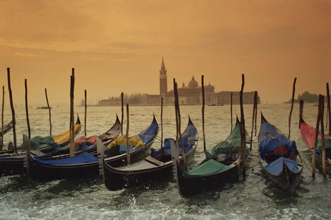 View past docked gondolas towards St. Mark´s Square, from across the Grand Canal, Venice, UNESCO World Heritage Site, Veneto, Italy, Europe