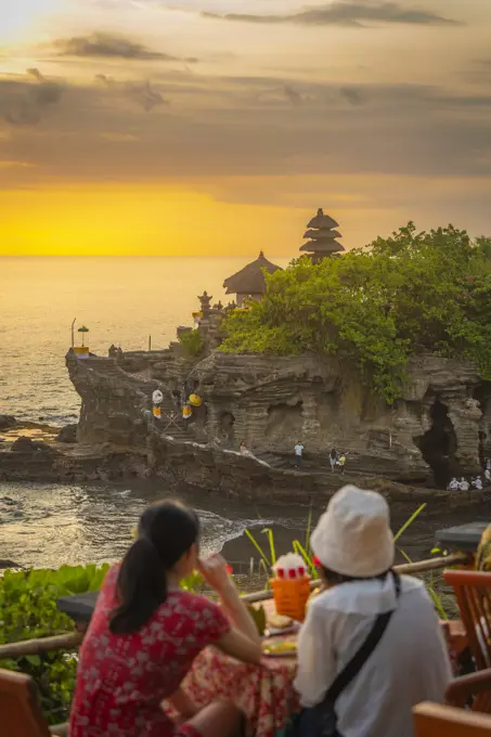 Tourists at Tanah Lot, traditional Balinese temple at sunset, Beraban, Kediri, Tabanan Regency, Bali, Indonesia, South East Asia, Asia