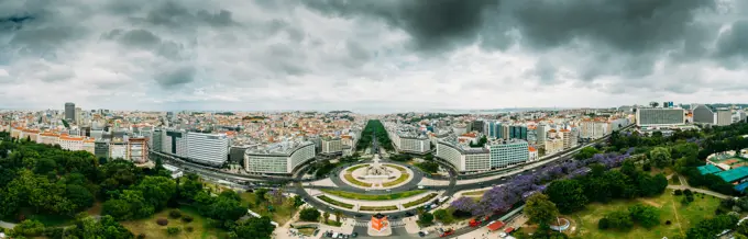 Aerial drone panoramic view of Parque Eduardo XII and Marques the Pombal looking south with Avenida da Liberdade in Lisbon, Portugal, Europe