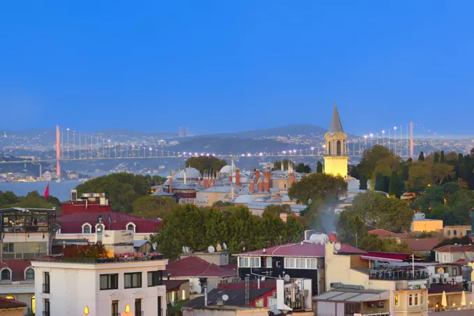 View of rooftops and Bosphorus Bridge at sunset, Istanbul, Turkey, Europe