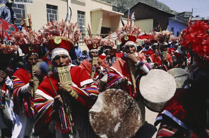 Musicians in bright costumes, Puno, Peru, South America