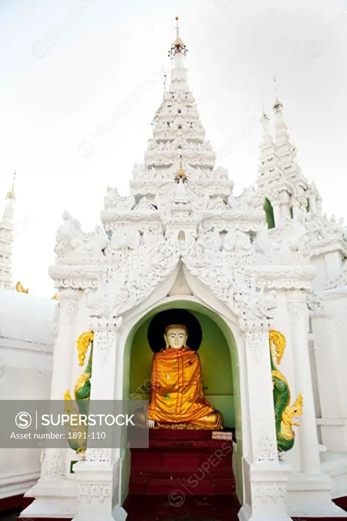 Statue of Buddha in a pagoda, Shwedagon Pagoda, Yangon, Myanmar