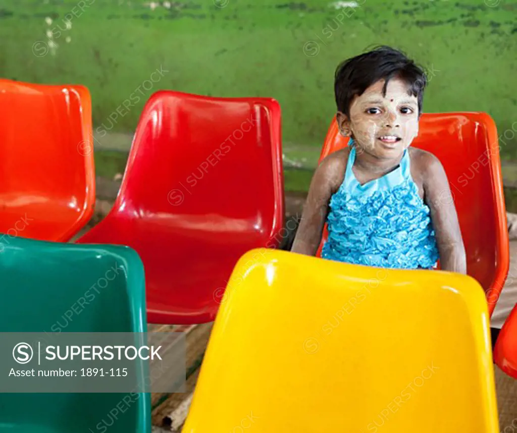 Girl sitting on a chair, Myanmar