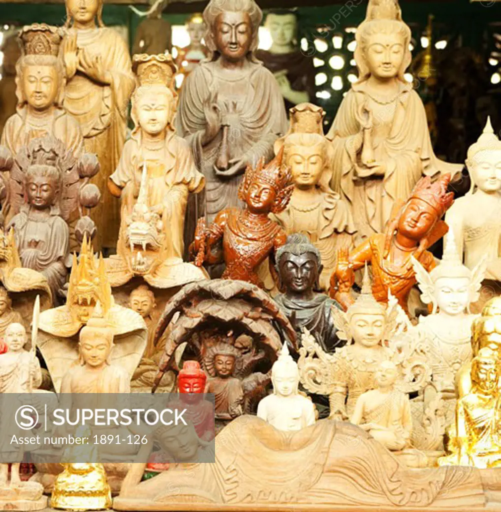 Statues of Buddha at a market stall, Myanmar